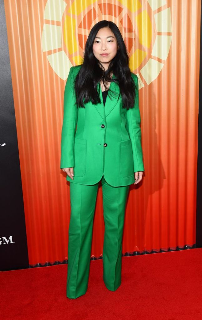 awkwafina in a bright green suit