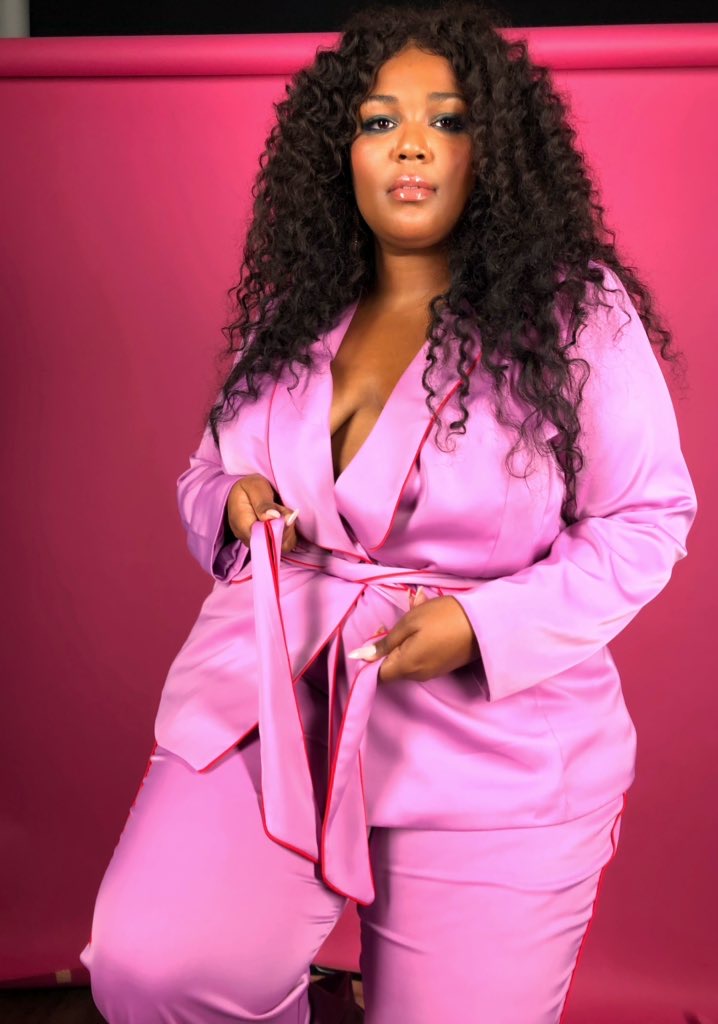 lizzo in a pink suit